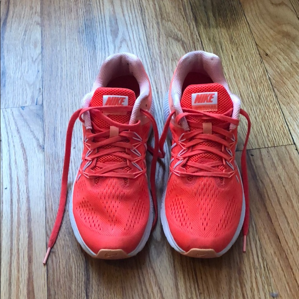 Neon pink Nike tennis shoes